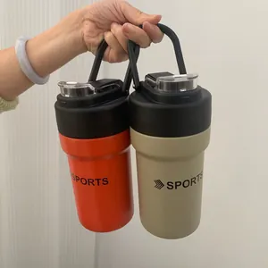 Close-up of portable stainless steel sports water bottles in orange and khaki colors