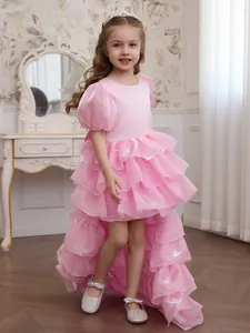 Elegant pink high-low flower girl dress with ruffled cake layers and puff sleeves