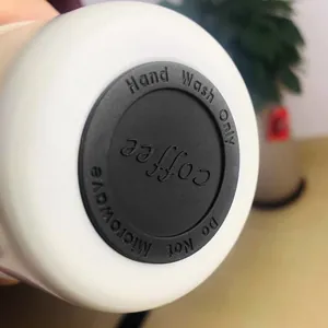 Bottom detail of 316 stainless steel coffee mug with hand wash only warning