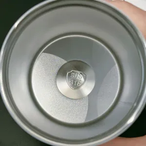 Detail view of the SUS 316 stainless steel interior bottom of an insulated coffee cup