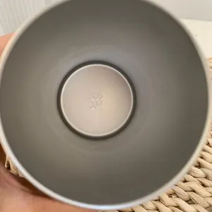 Detailed macro view showing the SUS 304 food-grade stainless steel interior of a water bottle