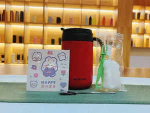 Close-up of a red 304 stainless steel insulated mug with handle and cute rabbit sticker