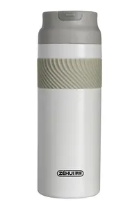 Close-up of white 316 stainless steel insulated water bottle with grey silicone grip