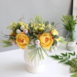 Elegant artificial yellow peony bouquet in a white vase for minimalist home decor