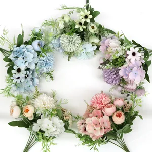 Close-up of five colorful artificial flower bouquets featuring roses and hydrangeas
