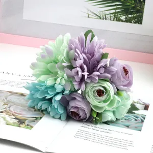 Detailed close-up of soft green and purple silk petals on a decorative artificial bouquet
