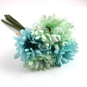 Detailed view of 6-piece artificial gerbera daisy bouquet in soft green and blue colors