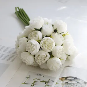 Close-up of lush 27-head white tea rose bouquet for home decoration