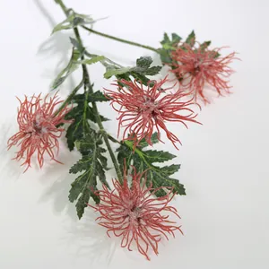 Macro detail of red flocked artificial crab claw chrysanthemum flowers for home decor.