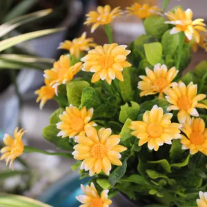 Close-up of vibrant yellow artificial daisy bouquet for outdoor balcony decoration