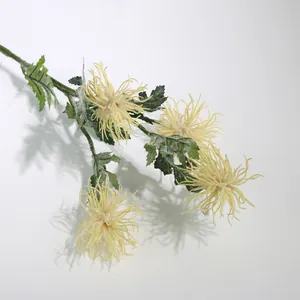 Detail view of a 4-head flocked yellow sea urchin chrysanthemum for Nordic home decor.
