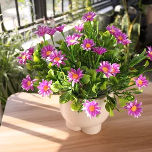 Macro view of artificial pink daisy bouquet in a cream foot-shaped pot for garden decor