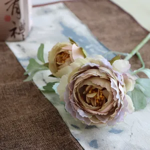 Close-up detail view of 2-head Ranunculus artificial flower with gradient silk petals