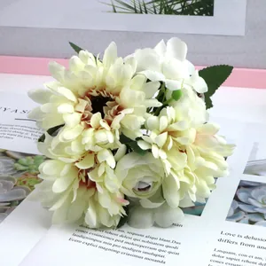 Close-up detail of cream artificial Gerbera daisy and rose bouquet for elegant home decor