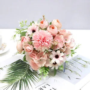 Close-up detail of a soft pink artificial rose and hydrangea bouquet for home decoration