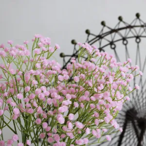 Close-up detail of delicate pink artificial baby's breath flowers for home floral decor