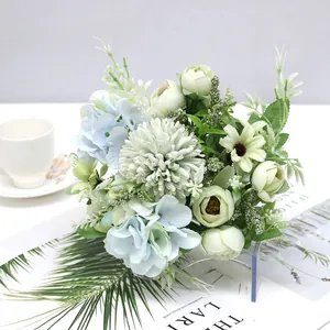 Close-up of Nordic style artificial bouquet with blue hydrangeas and green tea buds