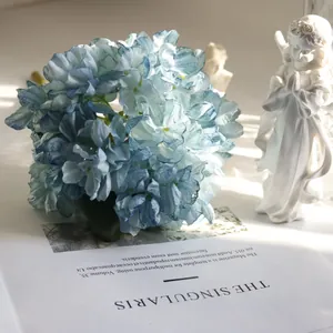 Close-up detail of French retro style blue artificial hydrangea with elegant burnt edges