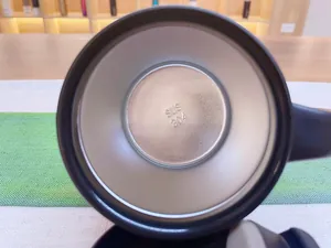 Detail macro view of SUS 304 stainless steel interior marking at the bottom of a mug