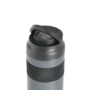 Close-up of 316 stainless steel insulated water bottle with flip-top lid and carry handle.