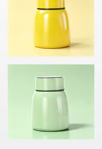 Macro view of yellow and green mini vacuum insulated food jars with temperature display
