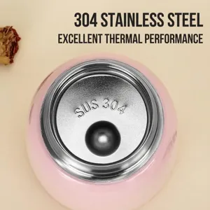 Close-up view of a pink 304 stainless steel vacuum insulated thermal food jar for soup