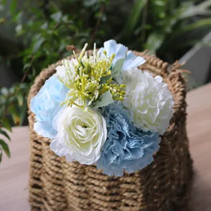 Close-up detail of silk artificial blue carnations and white roses for home decor