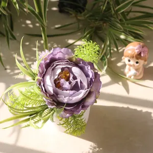Detailed view of artificial purple peony potted plant with natural sunlight shadows