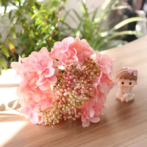 Detail shot of delicate pink artificial silk hydrangea flowers for home decoration