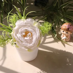 Artificial white peony potted plant in minimalist white vase for cozy home desk decor