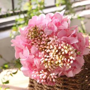 Detailed view of pink artificial hydrangea and carnation bouquet for home decor