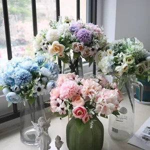 Close-up of artificial hydrangea and daisy flower bouquets arranged in Nordic vases