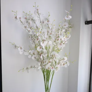 Detailed view of elegant white 5-branch dancing orchid oncidium silk flowers for decor