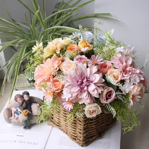 Close-up view of vibrant artificial dahlia and rose bouquet in a rustic woven straw basket