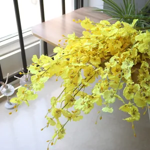 Close-up detail of yellow artificial Oncidium orchid flowers for home wedding decor
