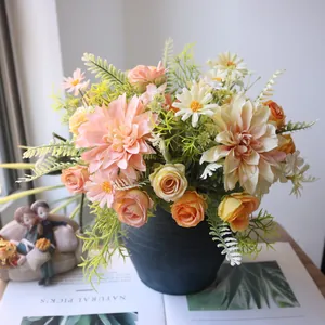 Detailed view of artificial dahlia, rose, and daisy silk flower arrangement in a blue vase