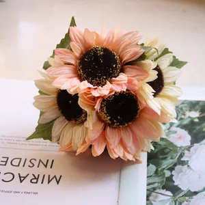 Close-up of artificial sunflower bouquet with realistic silk petals and dark centers.