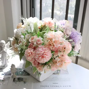 Elegant Nordic style mixed artificial flower bouquet with roses and hydrangeas in a white vase