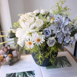 Close-up detail of artificial dahlia, rose, and daisy flower arrangement in a vase.
