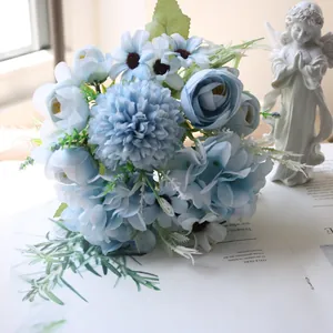 Close-up detail of artificial blue tea rose and hydrangea bouquet for home decoration