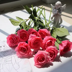 Detailed view of realistic pink silk roses for home and wedding decoration.
