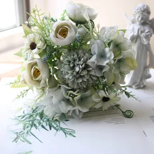 Detailed close-up of an artificial tea rose hydrangea and daisy bouquet for home decor