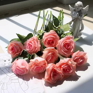 Detailed view of artificial pink moisturizing silk roses for romantic home and wedding decor
