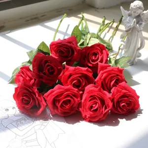 Detailed close-up view of realistic red silk roses for home and wedding decoration