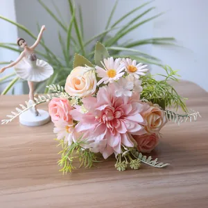 Close-up of artificial pink dahlia and peach rose bridal bouquet for elegant home decoration
