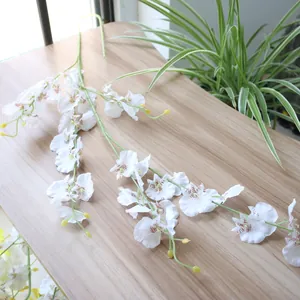 Close-up detail of white artificial Dancing Orchid flower with realistic silk petals