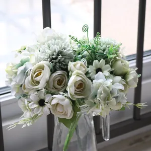 Close-up of elegant artificial white tea buds and daisies for Nordic home decoration