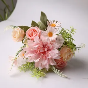 Detailed close-up of a silk artificial bridal bouquet with dahlia, roses, and daisies