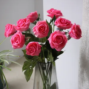 Vibrant pink silk artificial rose bouquet in an elegant glass vase for home decor