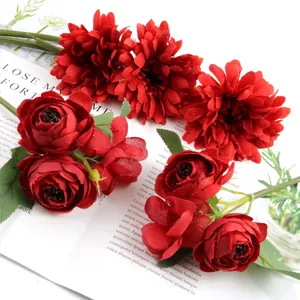 Close-up of deep red artificial Gerbera and rose bouquet with realistic fabric texture